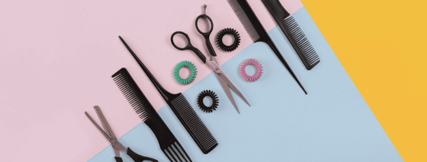 Hair styling tools on colorful background.